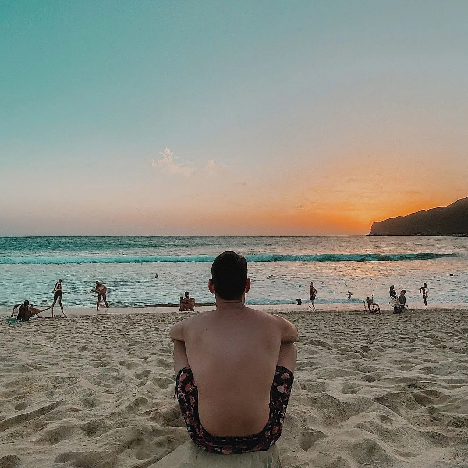 Budget Travel: Image of a person enjoying a beach with few people