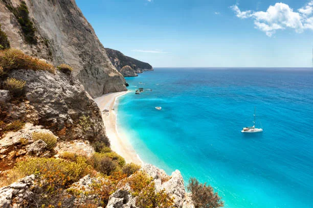 Lefkada: Windsurf in Vassiliki, hike to Dimosari Waterfalls, or discover secluded beaches like Porto Katsiki.