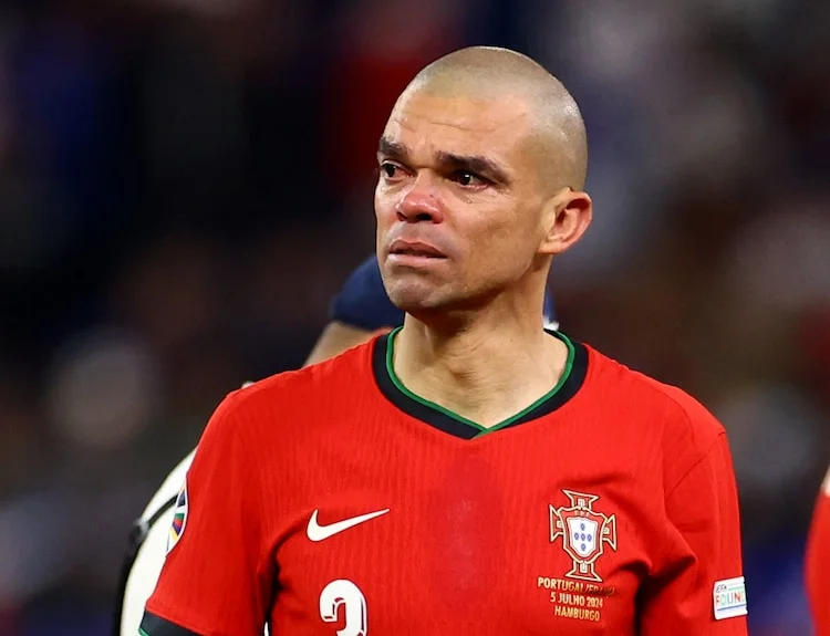 Portugal's Pepe and Cristiano Ronaldo look dejected after loss vs France