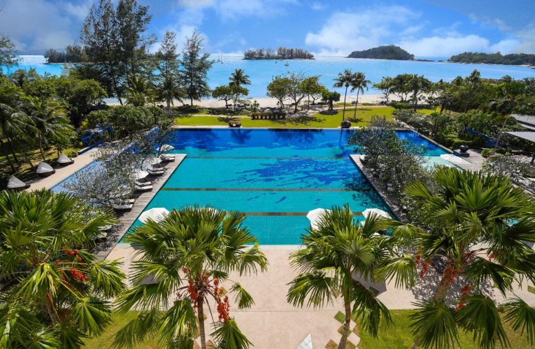 Experience timeless elegance at The Danna Langkawi. This beachfront gem boasts a whitewashed colonial facade and stylish interiors, creating a classic yet luxurious ambiance.