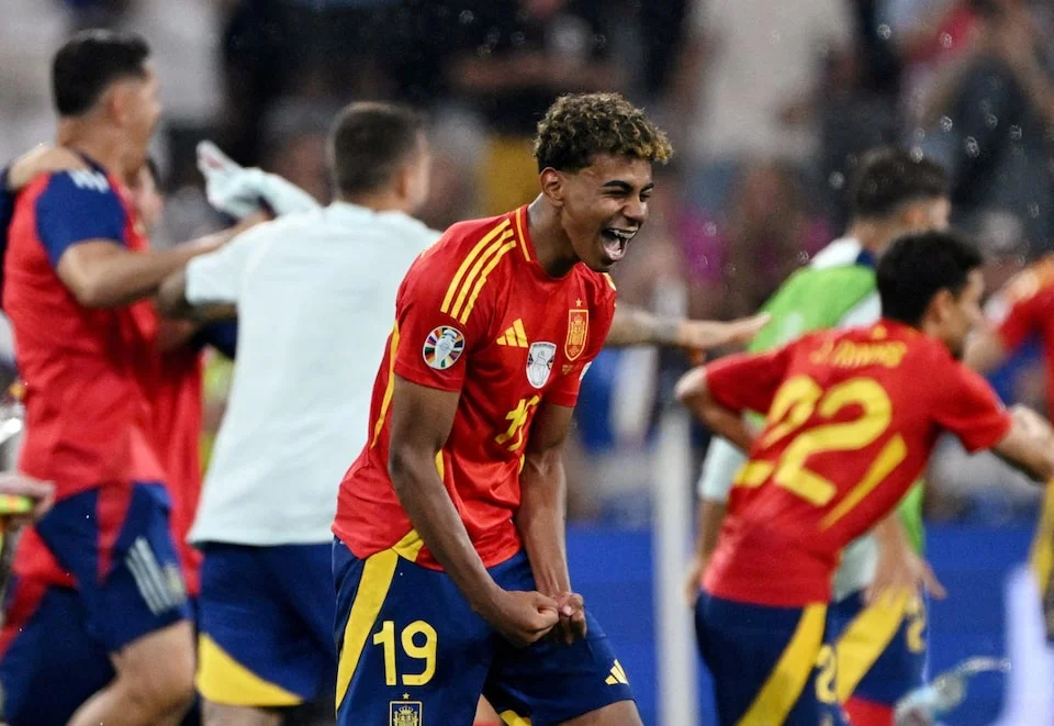 Spain's Lamine Yamal celebrates after the match