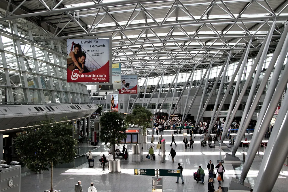 Main terminal of Düsseldorf Airport in Germany showcasing efficient layout and modern passenger facilities